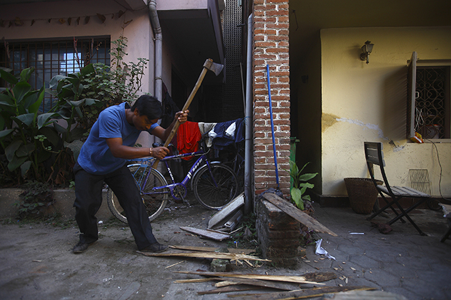 https://archive.nepalitimes.com/assets/uploads/gallery/1d2c1-cutting-wood.jpg