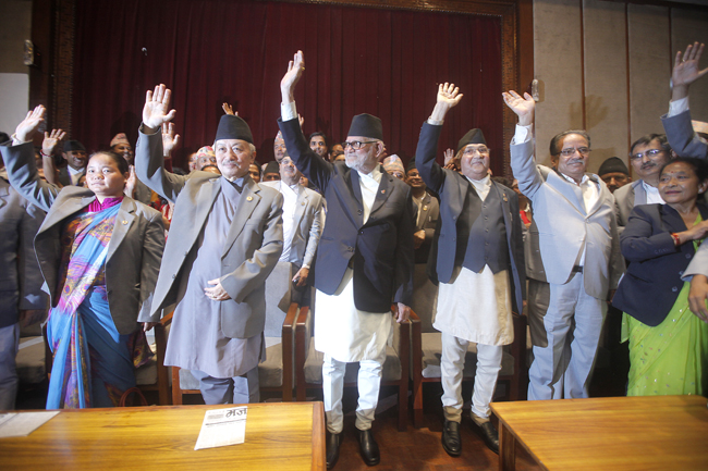 https://archive.nepalitimes.com/assets/uploads/gallery/51683-Constitution-bill-signed.jpg