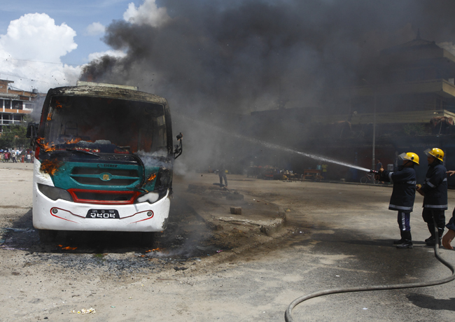 https://archive.nepalitimes.com/assets/uploads/gallery/7197b-bus-burning-constitution-day.jpg