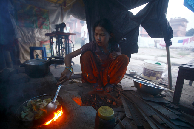 https://archive.nepalitimes.com/assets/uploads/gallery/8f3ee-cooking-food-in-firewood.jpg