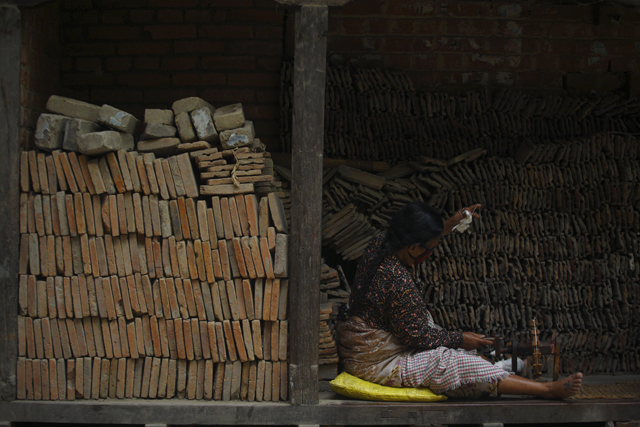 https://archive.nepalitimes.com/assets/uploads/gallery/e859e-Cotton-wicks-by-a-pile-of-roof-tiles.jpg