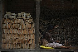 https://archive.nepalitimes.com/image.php?&width=250&image=/assets/uploads/gallery/e859e-Cotton-wicks-by-a-pile-of-roof-tiles.jpg